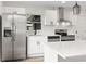 Modern kitchen featuring stainless steel appliances, white cabinets and countertops and eat-in island at 8933 W 1050 S, Fortville, IN 46040