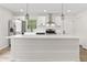 Contemporary kitchen with stainless steel appliances, a large island, and white cabinets at 8933 W 1050 S, Fortville, IN 46040