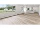 Open-concept living space with stylish flooring and a view into the bright kitchen at 8933 W 1050 S, Fortville, IN 46040