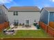 This backyard has a patio, lawn, outdoor furniture, and a fire pit at 918 Cass Dr, Franklin, IN 46131