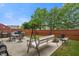 Relaxing backyard features a swing, outdoor seating, a grill, and a fire pit, great for entertaining at 918 Cass Dr, Franklin, IN 46131