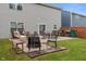 Spacious backyard featuring a swing set, outdoor seating, grill, fire pit, and ample green space at 918 Cass Dr, Franklin, IN 46131