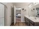 Bathroom showcasing a double vanity with an entrance to the bedroom and shower at 918 Cass Dr, Franklin, IN 46131