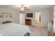 Spacious bedroom with carpet, a ceiling fan, and entryways to the bathroom and hallway at 918 Cass Dr, Franklin, IN 46131