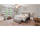 Comfortable bedroom featuring a ceiling fan, neutral paint, soft carpet, and an upholstered bed at 918 Cass Dr, Franklin, IN 46131