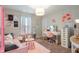 Bedroom with pink accents, a makeup vanity, and a modern light fixture at 918 Cass Dr, Franklin, IN 46131