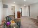 Open concept bonus room with carpet, neutral paint, and a stylish side chair at 918 Cass Dr, Franklin, IN 46131