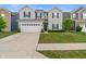 Two-story home with gray siding, black shutters, a two car garage and a well manicured front yard at 918 Cass Dr, Franklin, IN 46131