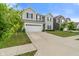 A view of the exterior of the house with gray siding and a two car garage at 918 Cass Dr, Franklin, IN 46131