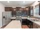 The kitchen is equipped with stainless steel appliances and modern cabinets at 918 Cass Dr, Franklin, IN 46131