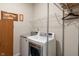 Well-equipped laundry room features modern appliances and shelving for optimal storage at 918 Cass Dr, Franklin, IN 46131