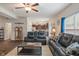 Inviting living room boasts hardwood floors and a comfortable leather furniture set at 918 Cass Dr, Franklin, IN 46131