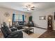 Living room featuring comfortable seating, a ceiling fan, and natural light at 918 Cass Dr, Franklin, IN 46131