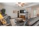 Spacious living room with wood floors, comfortable seating, and a ceiling fan at 918 Cass Dr, Franklin, IN 46131