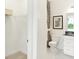 Bathroom with white marbled floors, toilet with unique covering, and a closet at 9351 Abner St, McCordsville, IN 46055