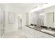 Modern bathroom featuring a double sink vanity and a glass-enclosed shower at 9351 Abner St, McCordsville, IN 46055