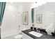 Bright bathroom featuring shower and tub combination and a modern vanity with black countertop at 9351 Abner St, McCordsville, IN 46055
