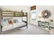 Bedroom featuring bunk beds, a geometric mirror, and a storage console at 9351 Abner St, McCordsville, IN 46055