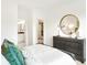 Bedroom featuring a dresser, gold mirror and an ensuite bathroom at 9351 Abner St, McCordsville, IN 46055