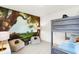 Bedroom featuring bunk beds, a whimsical wall design, and cushioned chairs at 9351 Abner St, McCordsville, IN 46055