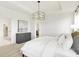 Bright bedroom with a tray ceiling and neutral color scheme at 9351 Abner St, McCordsville, IN 46055
