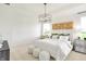 Bright bedroom with stylish decor, tray ceiling and ample natural light at 9351 Abner St, McCordsville, IN 46055