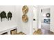Hallway boasts mudroom built-ins, decorative wall art, and open view into playroom at 9351 Abner St, McCordsville, IN 46055