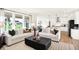 Bright and airy living room with expansive windows and a view of the outdoor space at 9351 Abner St, McCordsville, IN 46055