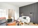 Stylish living room featuring a comfortable sofa, gray accent wall and modern décor at 9351 Abner St, McCordsville, IN 46055