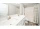 Bathroom with double vanity, quartz countertop, and shower/tub combo at 9369 Casey Rd, Pendleton, IN 46064