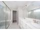 Bright bathroom with double vanity, glass enclosed shower, and neutral color palette at 9369 Casey Rd, Pendleton, IN 46064