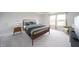 Well-lit bedroom with large bed, modern furniture, and windows at 9369 Casey Rd, Pendleton, IN 46064