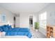 Comfortable bedroom with blue bedding, neutral walls, and a walk-in closet at 9369 Casey Rd, Pendleton, IN 46064