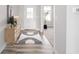 Bright entryway with a modern rug, stylish console table, and wood-look flooring at 9369 Casey Rd, Pendleton, IN 46064