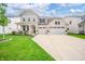 Inviting two-story home featuring a manicured lawn and a spacious three-car garage at 9369 Casey Rd, Pendleton, IN 46064