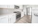 Modern kitchen features white cabinets and stainless steel appliances at 9369 Casey Rd, Pendleton, IN 46064