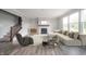 Spacious living room with a fireplace and large windows at 9369 Casey Rd, Pendleton, IN 46064