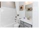 A clean white bathroom with tub, shower, and grey vanity at 9387 Abner St, McCordsville, IN 46055