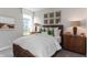 This bedroom has a lovely decor with a bright window and a plush bed at 9387 Abner St, McCordsville, IN 46055