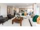 Cozy living room with a modern design, comfortable seating, and a view into the kitchen at 9387 Abner St, McCordsville, IN 46055