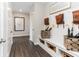 Cozy mud room offers built-in bench, storage, and wall hooks to organize shoes, bags, and umbrellas at 9387 Abner St, McCordsville, IN 46055