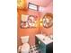 Unique bathroom with peach colored walls, modern vanity, decorative light fixture, and a unique piece of art at 949 E Southern Ave, Indianapolis, IN 46203