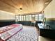 Bright bedroom featuring a wooden ceiling, large windows, and an artist's easel, offering an inspiring space at 949 E Southern Ave, Indianapolis, IN 46203
