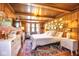 A cozy bedroom showcasing wood-paneled walls, a comfy bed, and stylish decor, creating a relaxing and inviting ambiance at 949 E Southern Ave, Indianapolis, IN 46203