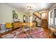 Elegant dining room featuring hardwood floors, a modern chandelier, and stylish decor at 949 E Southern Ave, Indianapolis, IN 46203