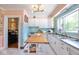 Well-lit kitchen with white cabinetry, stainless steel appliances, and modern countertops at 949 E Southern Ave, Indianapolis, IN 46203