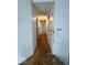 Hallway with white walls, wood floor, and two doors at 9560 Bay Vista E Dr, Indianapolis, IN 46250