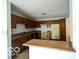 Eat-in kitchen features wood cabinets and ample counter space; ready for updates at 9560 Bay Vista E Dr, Indianapolis, IN 46250