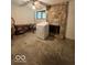 Laundry area with stone fireplace, table and shelving at 9560 Bay Vista E Dr, Indianapolis, IN 46250