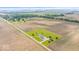 Expansive aerial view of the property showcasing the house nestled amidst farmland and lush greenery at 9605 W 100 S, Jamestown, IN 46147